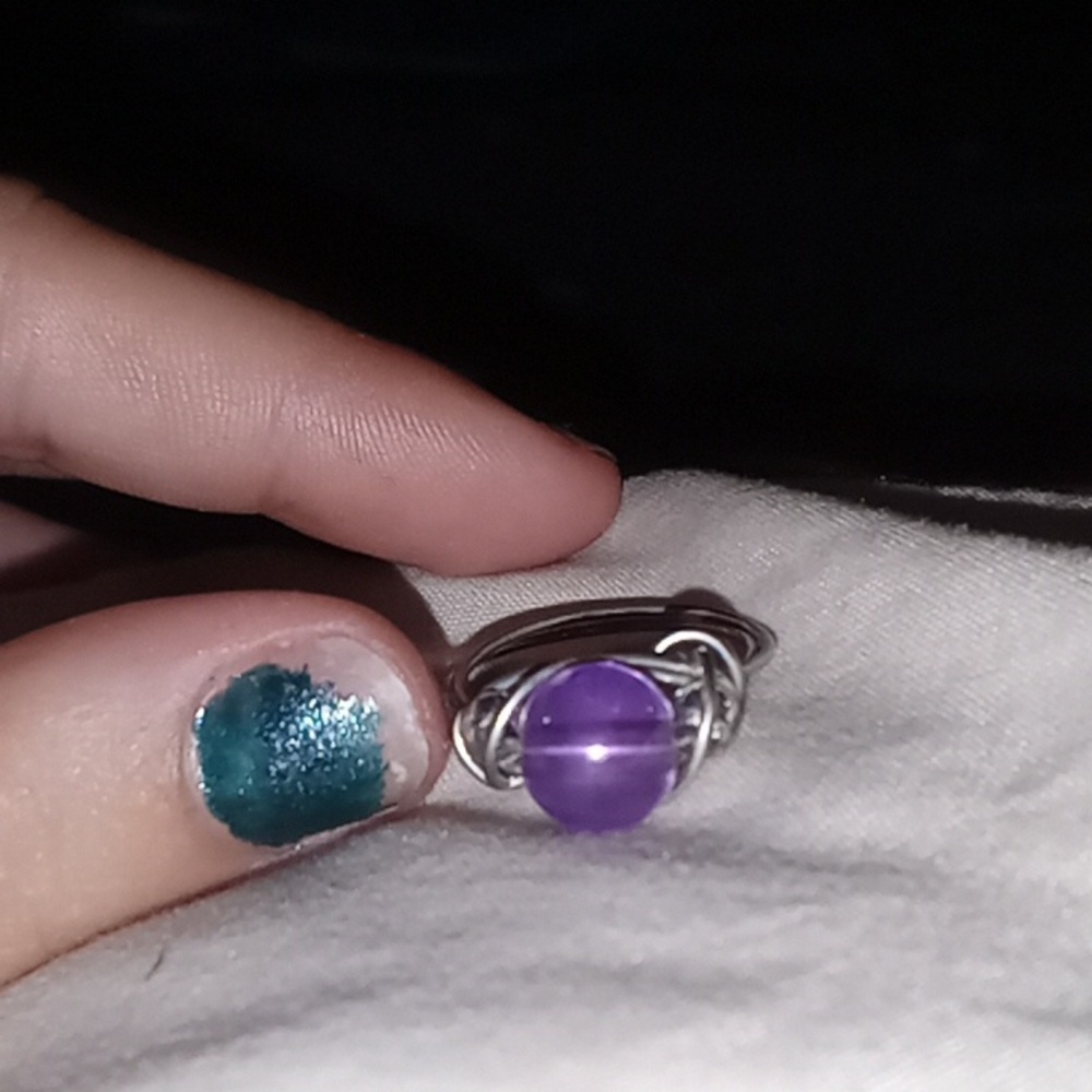 A purple and silver ring